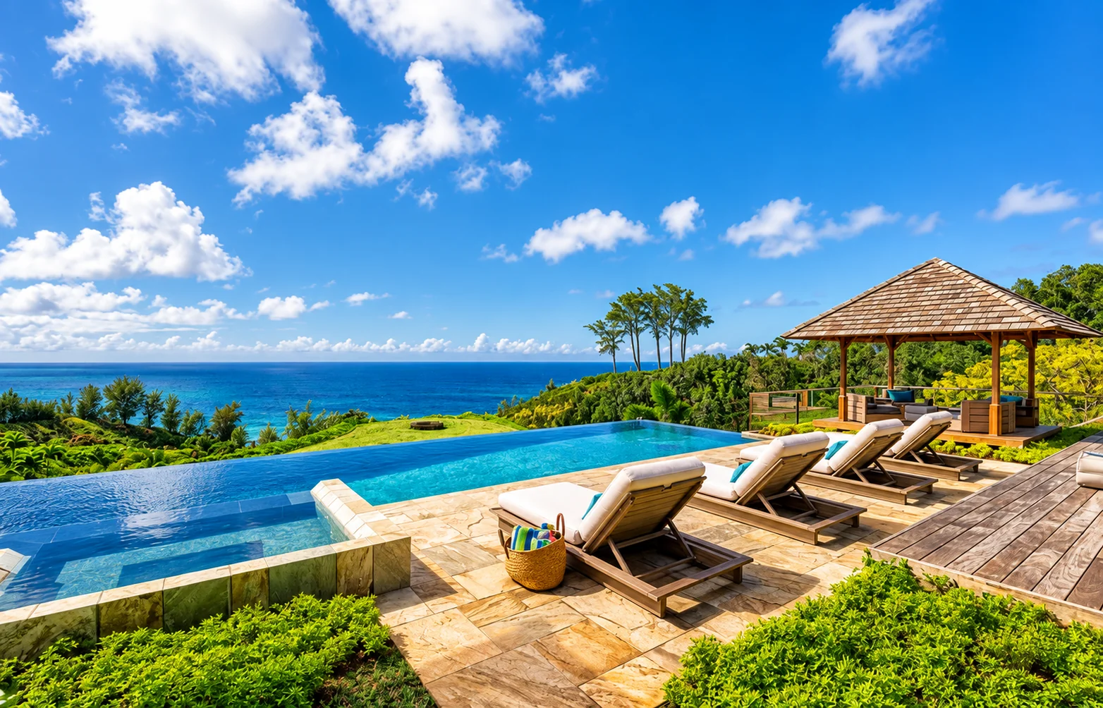 An oceanview infinity pool with loungers and a gazebo in Kauai